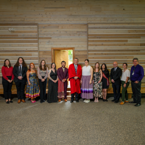 Group photo of medical and midwifery graduates, faculty and staff during the Indigenous graduation ceremony last week at the UBC First Nations Longhouse.